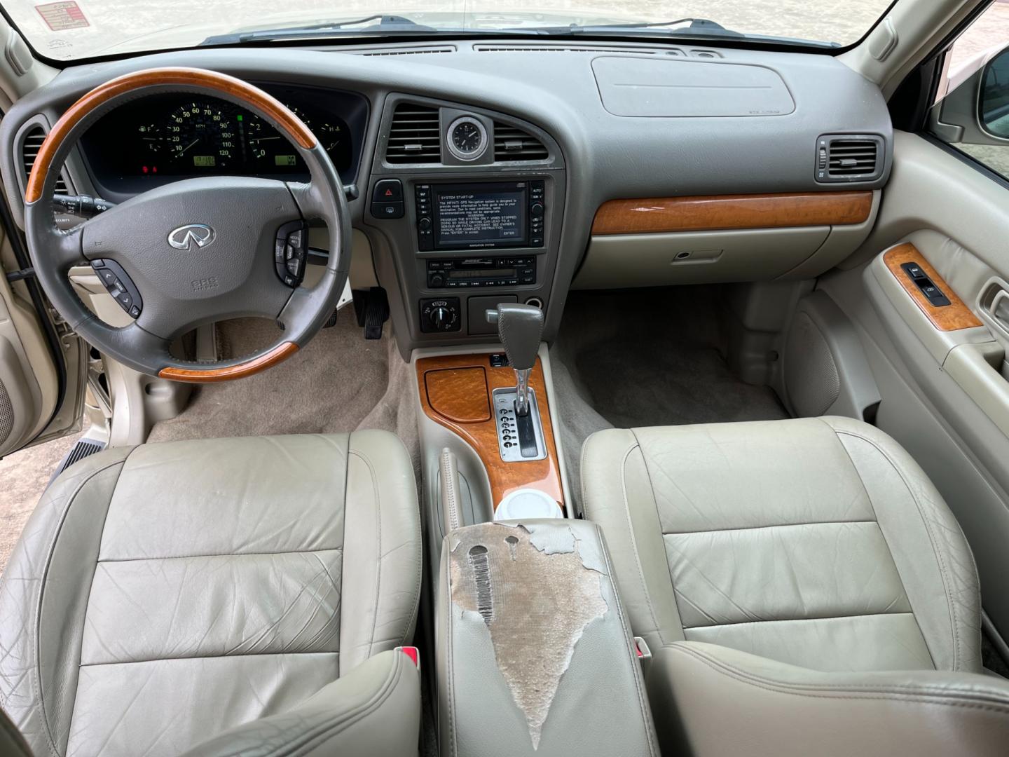 2003 tan /TAN Infiniti QX4 4WD (JNRDR09Y53W) with an 5 engine, 4-Speed Automatic Overdrive transmission, located at 14700 Tomball Parkway 249, Houston, TX, 77086, (281) 444-2200, 29.928619, -95.504074 - Photo#10